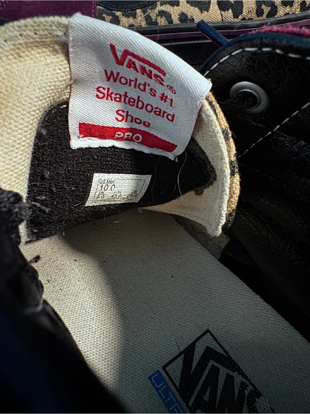 Vans High Top Skate Shoes in Black with Leopard Trim and Burgundy Accents